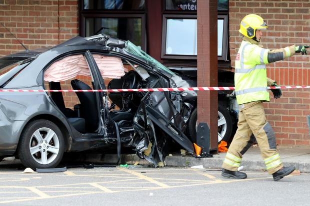 Woman in her 80s fights for life after her Mazda hits Christchurch Premier Inn following lorry crash